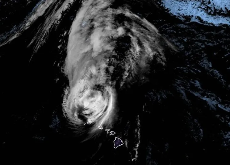 Hurricane Lowell, with 105 mph winds, passes west of Hawaii, dropping heavy rain and sending pounding surf that may cause hundreds of millions in damage