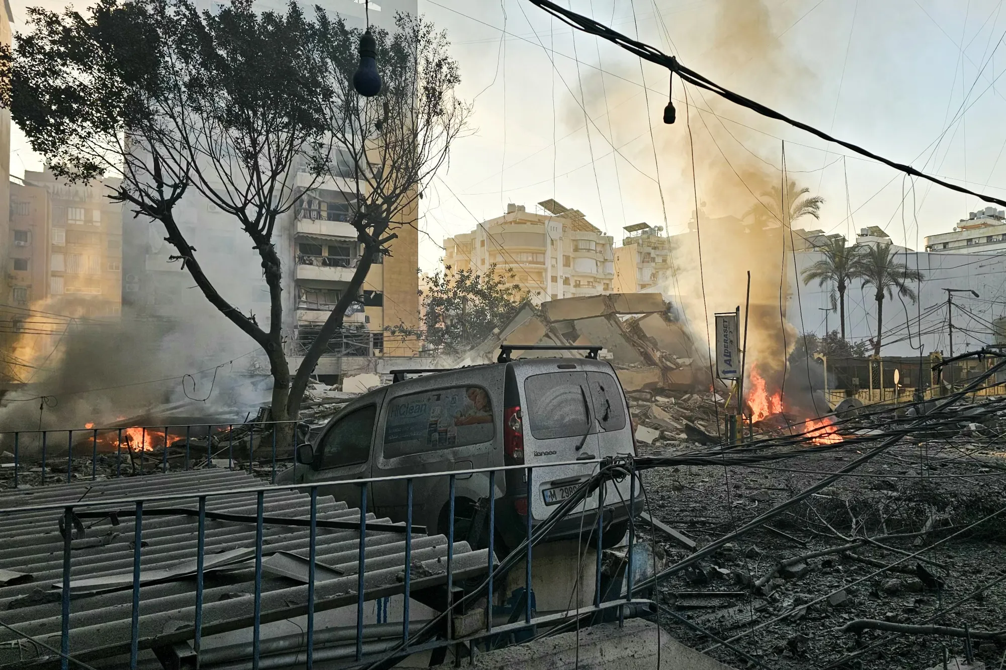 Fires erupt near buildings damaged during a&nbsp;strike on Beirut's southern suburbs on March 3.