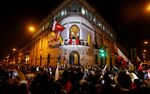 Peruvian leftist presidential candidate Pedro Castillo of Peru Libre waves to supporters from his party headquarters balcony in Lima on June 8.