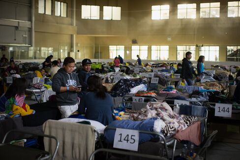 Fort McMurray evacuees gather at a hockey rink in Lac La Biche on Thursday.