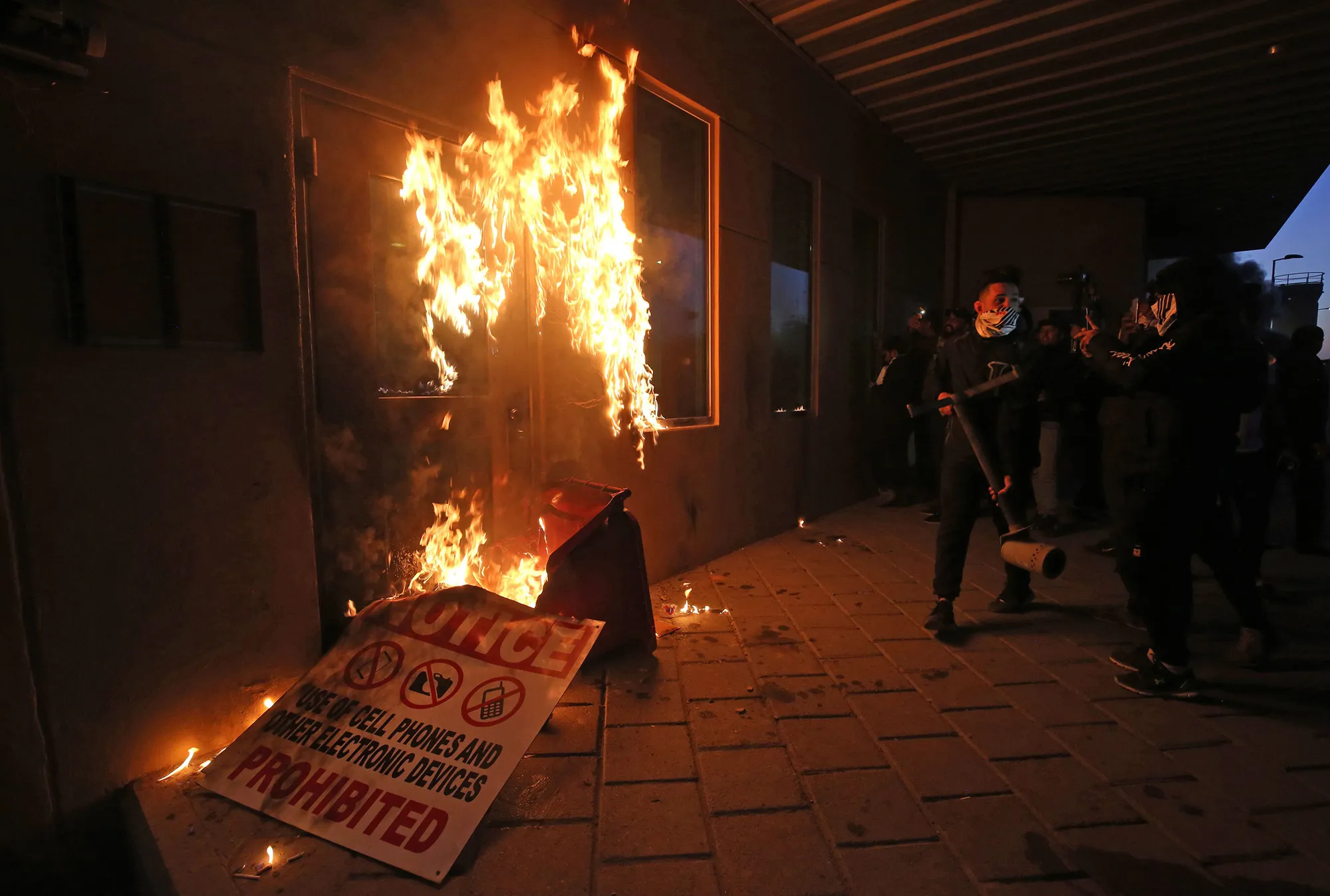 Protesters try to break into the U.S. embassy building in Baghdad on Dec. 31, 2019.