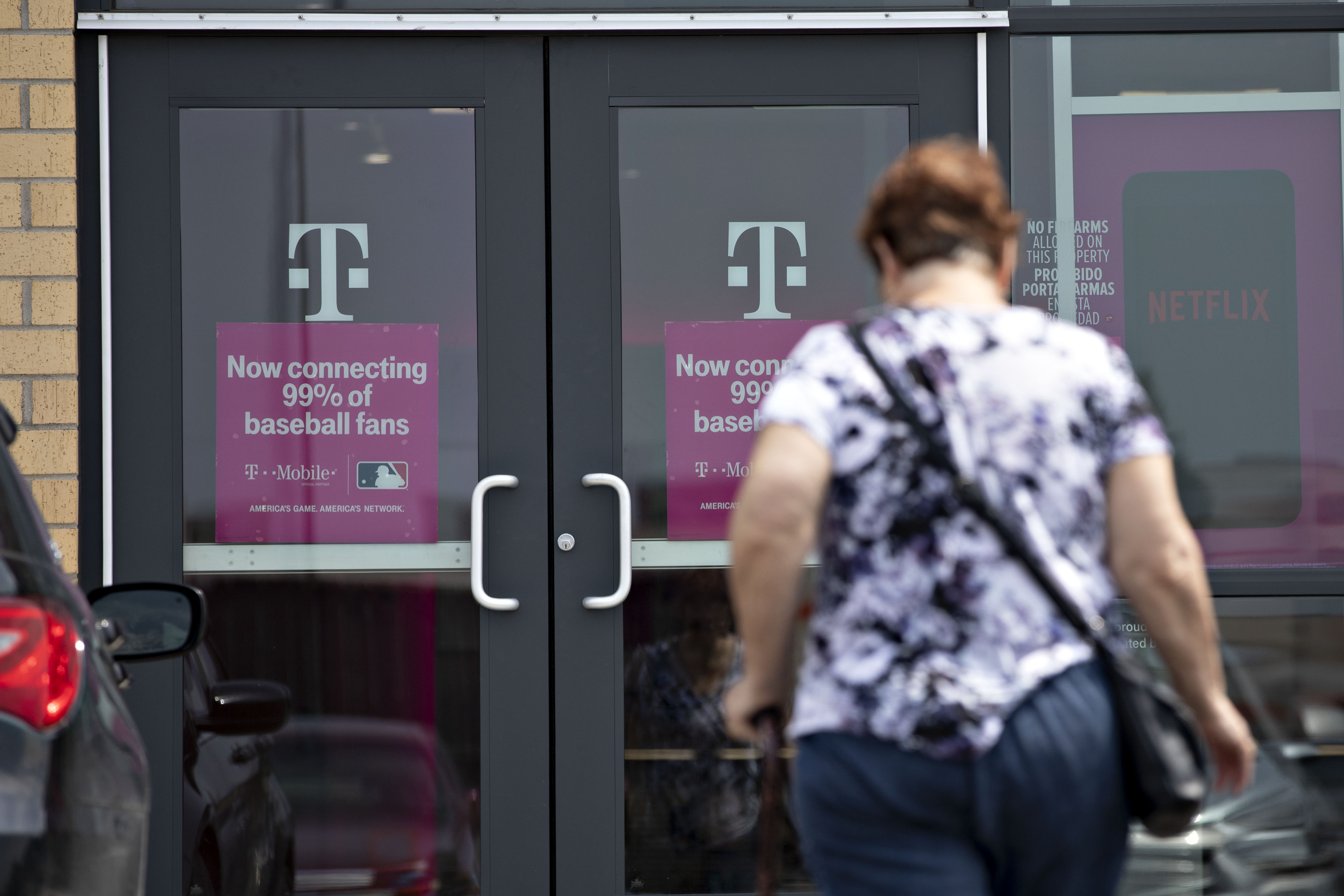A person arrives at a T-Mobile US Inc. store in Peru, Illinois.