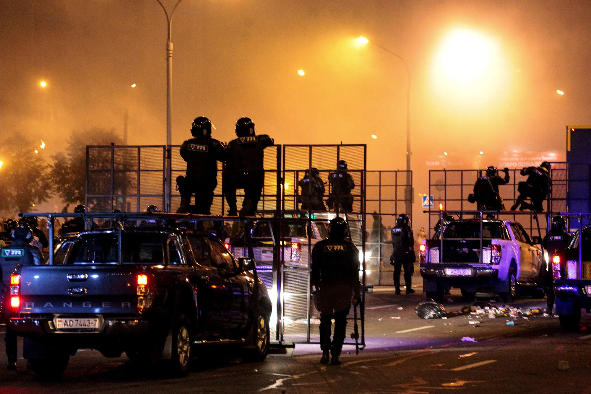 Riot police disperse protesters after polls closed in the presidential election in Minsk on Aug. 9.