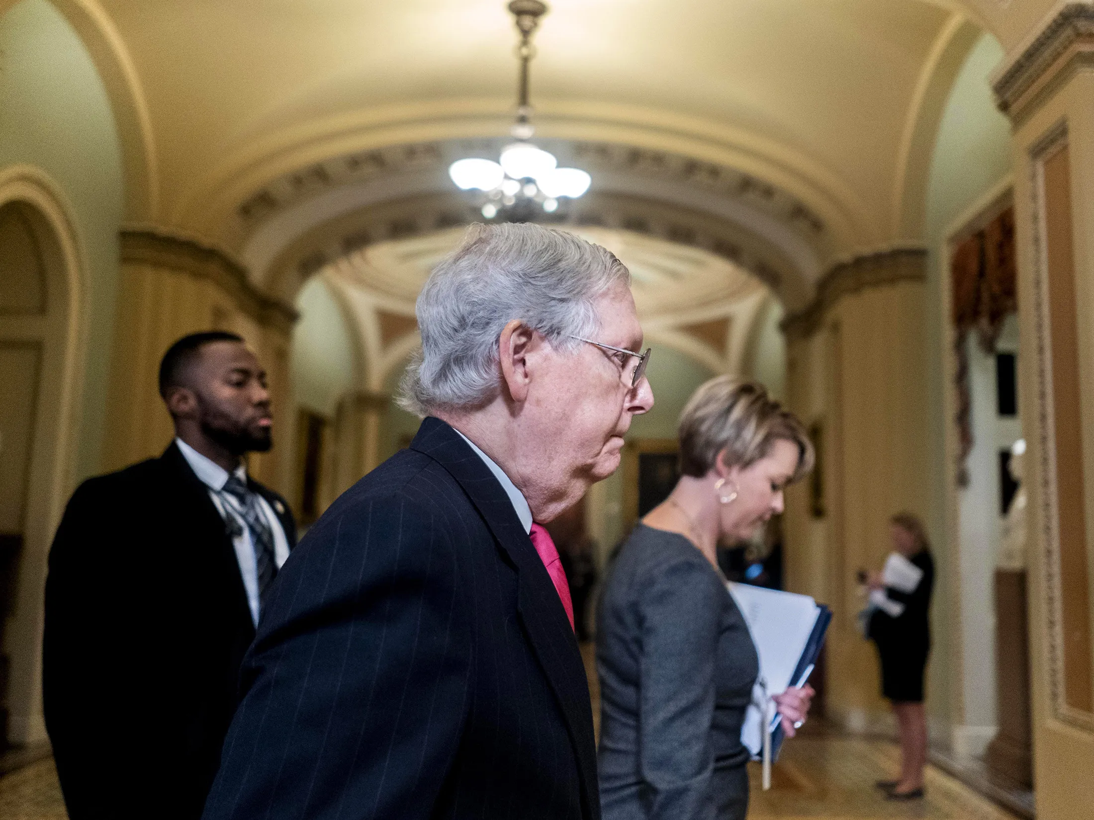Majority Leader&nbsp;Mitch McConnell leaves the Senate floor on Jan. 28.