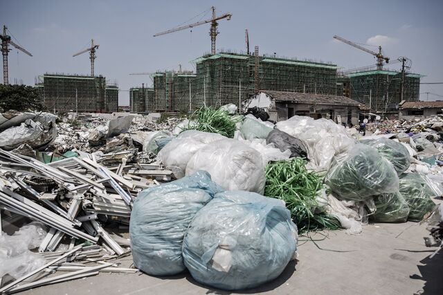 Piles of scrap and waste sit in a neighborhood slated for redevelopment in Shanghai