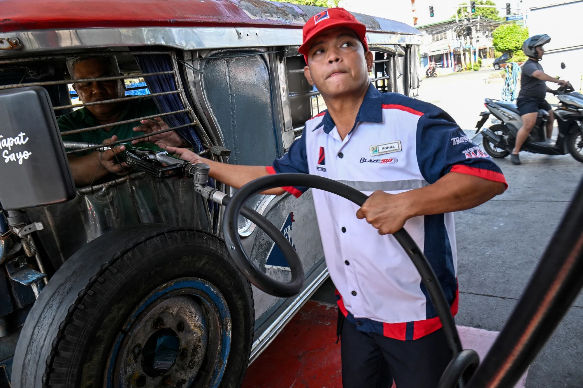 A Jeepney is refueled with diesel in Manila on March 23.