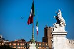 The Italian national flag flies near a monument to the unknown soldier in Rome, Italy, on Saturday, Oct. 20, 2018.