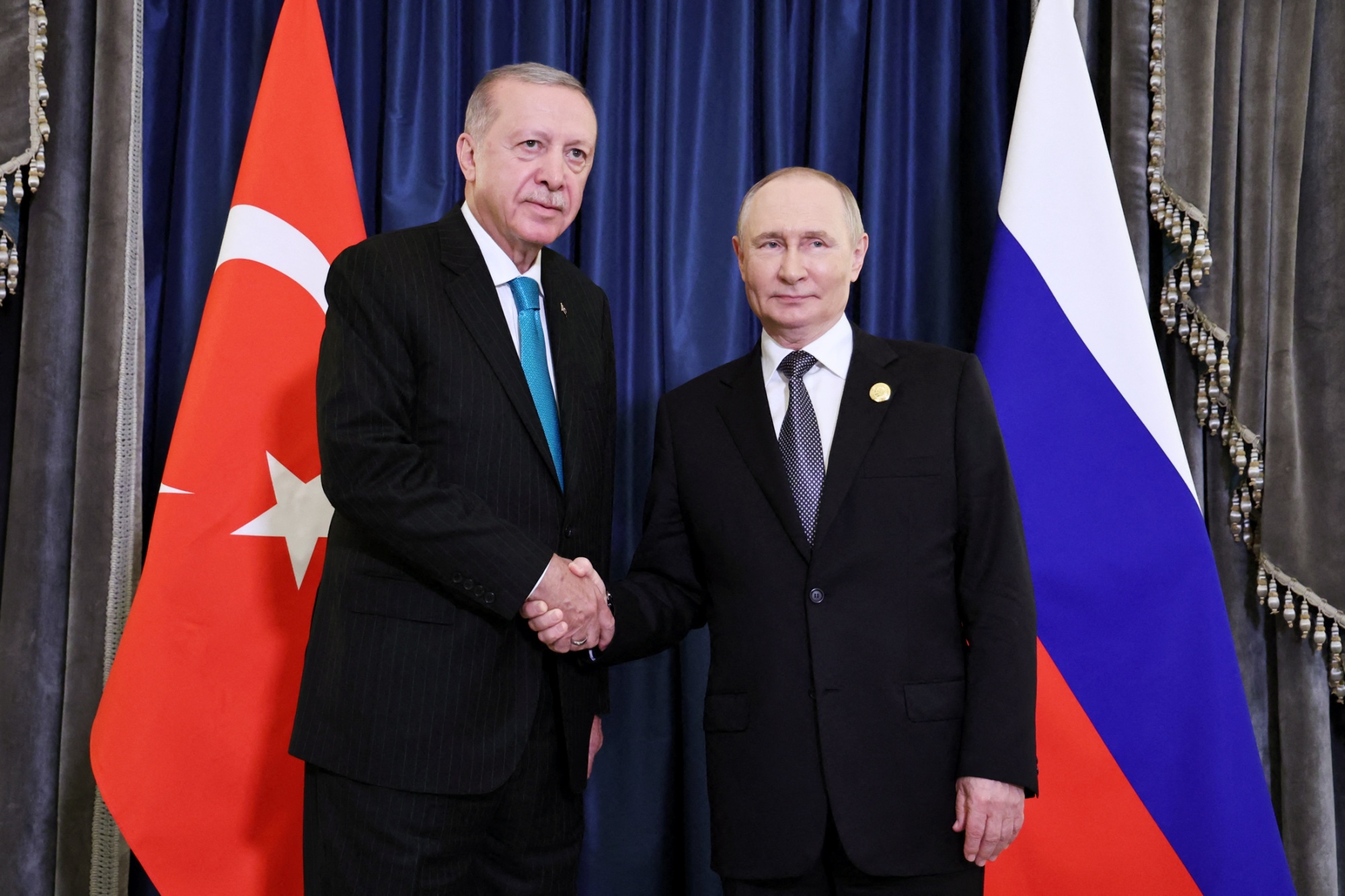 Recep Tayyip Erdogan and Vladimir Putin in Tianjin, China, in this photo released by Russian state media on Sept. 1. Photographer: Alexander Kazakov/Sputnik/AFP/Getty Images