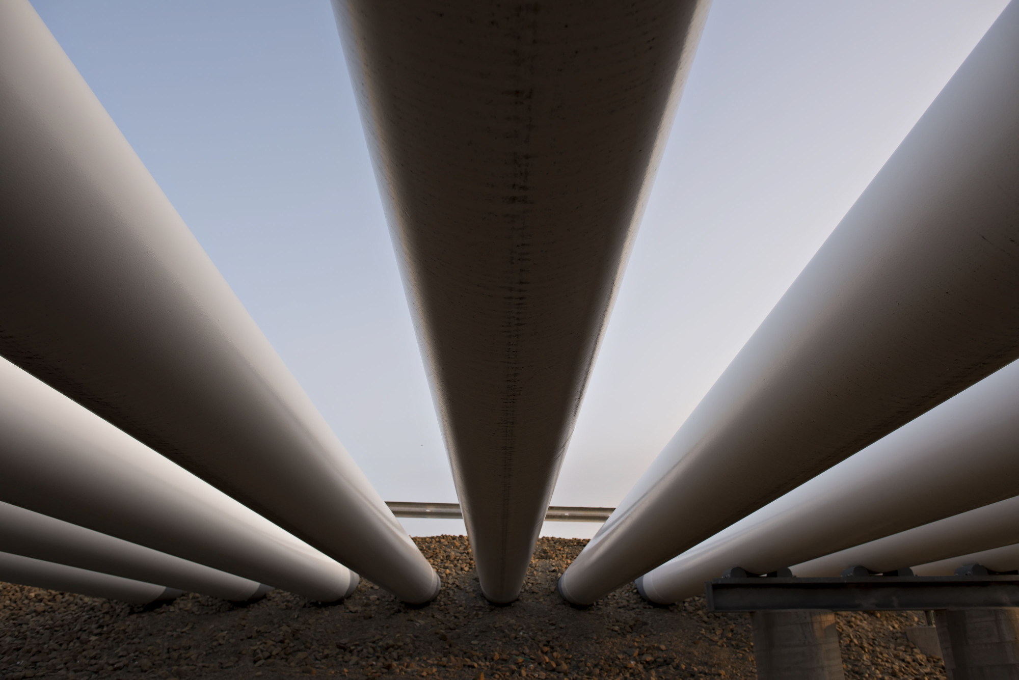 Oil pipes run into the ground at the Enbridge Inc. Cushing storage terminal in Cushing, Oklahoma, U.S., on&nbsp;March 25, 2015.&nbsp;