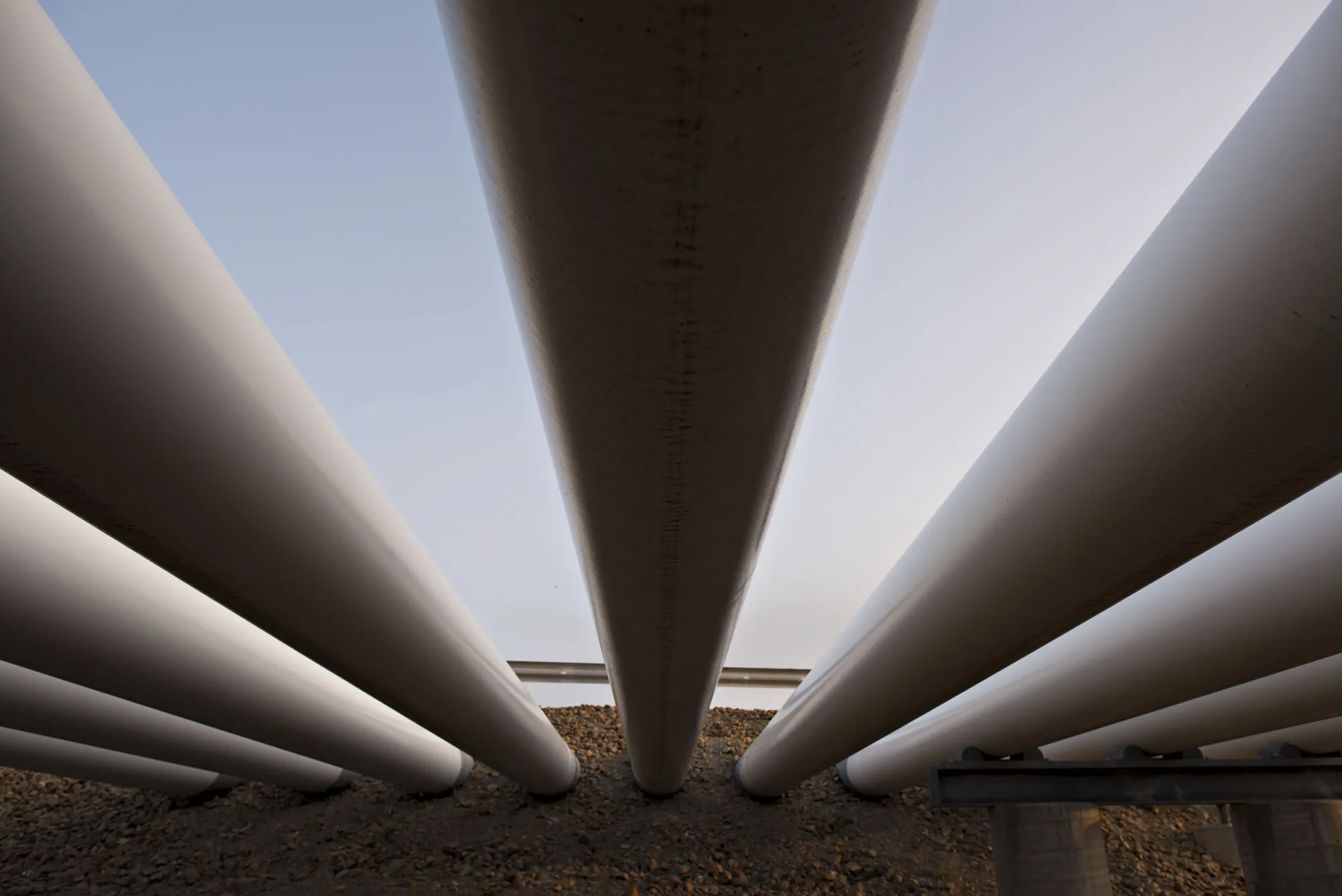 Oil pipes run into the ground at the Enbridge Inc. Cushing storage terminal in Cushing, Oklahoma, U.S., on&nbsp;March 25, 2015.&nbsp;