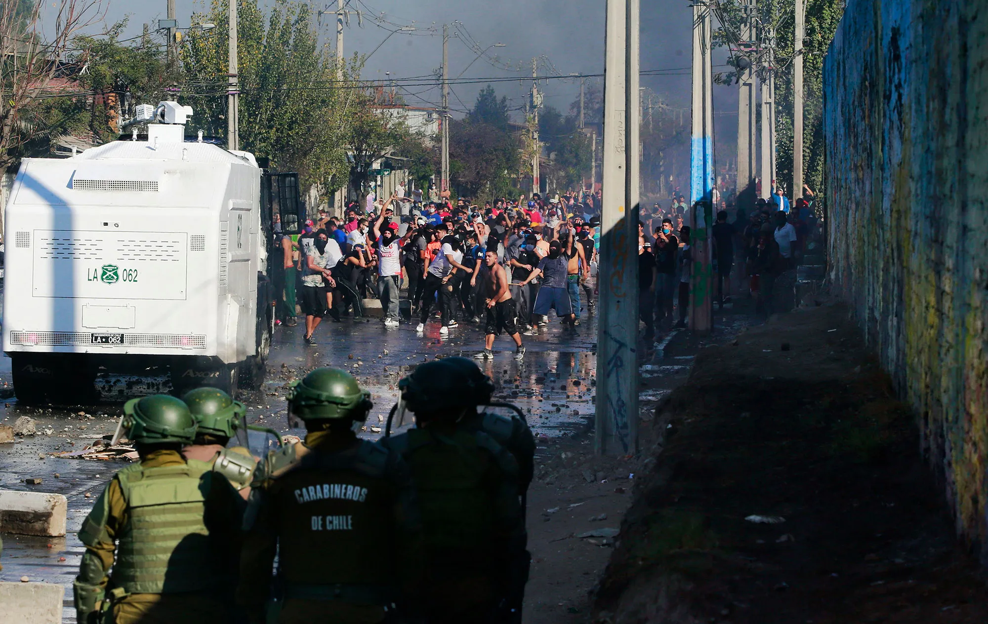 Demonstrators clash with riot police during a protest in Santiago on May 18.
