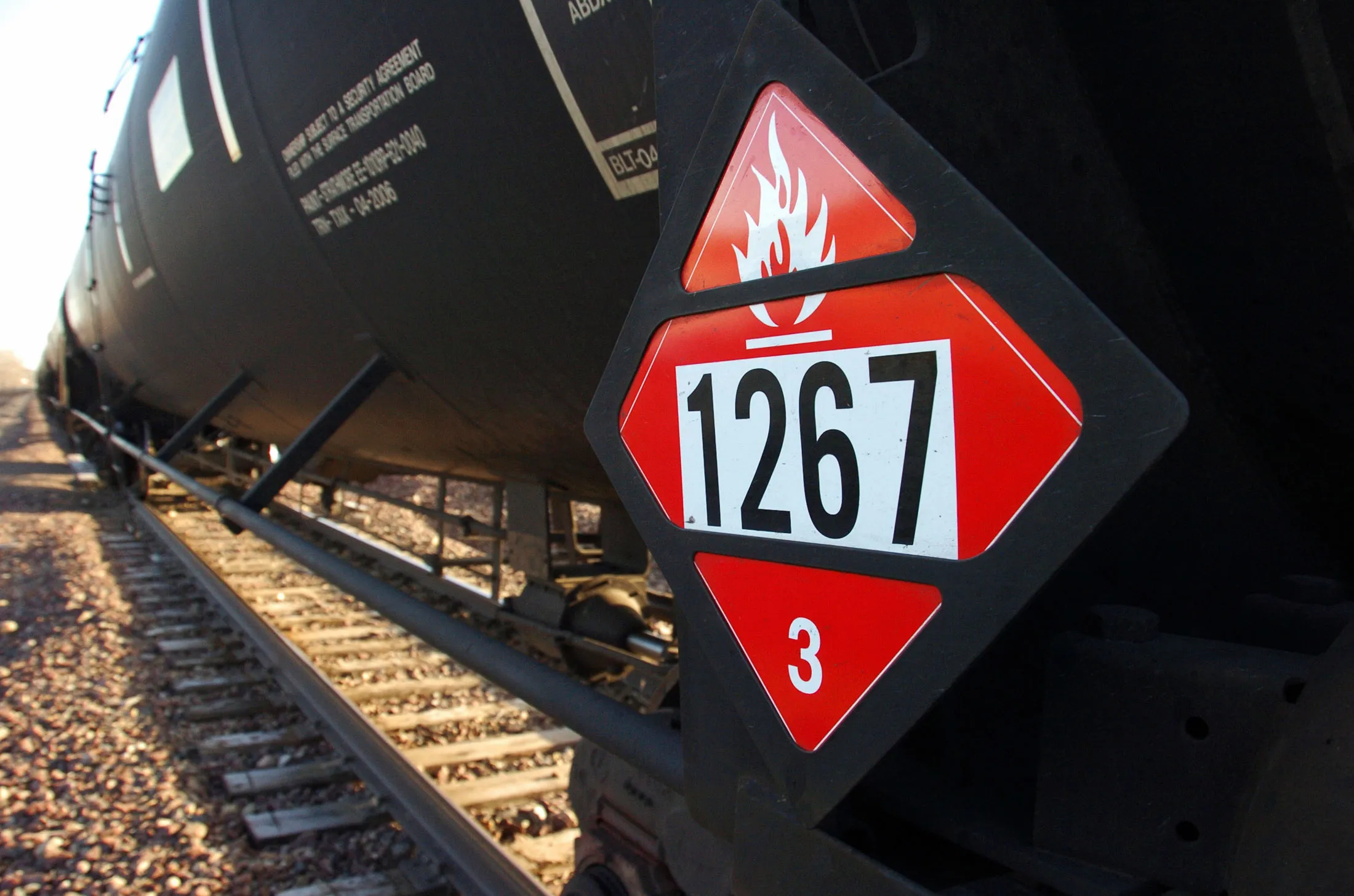 A warning placard on a train car carrying crude oil.

