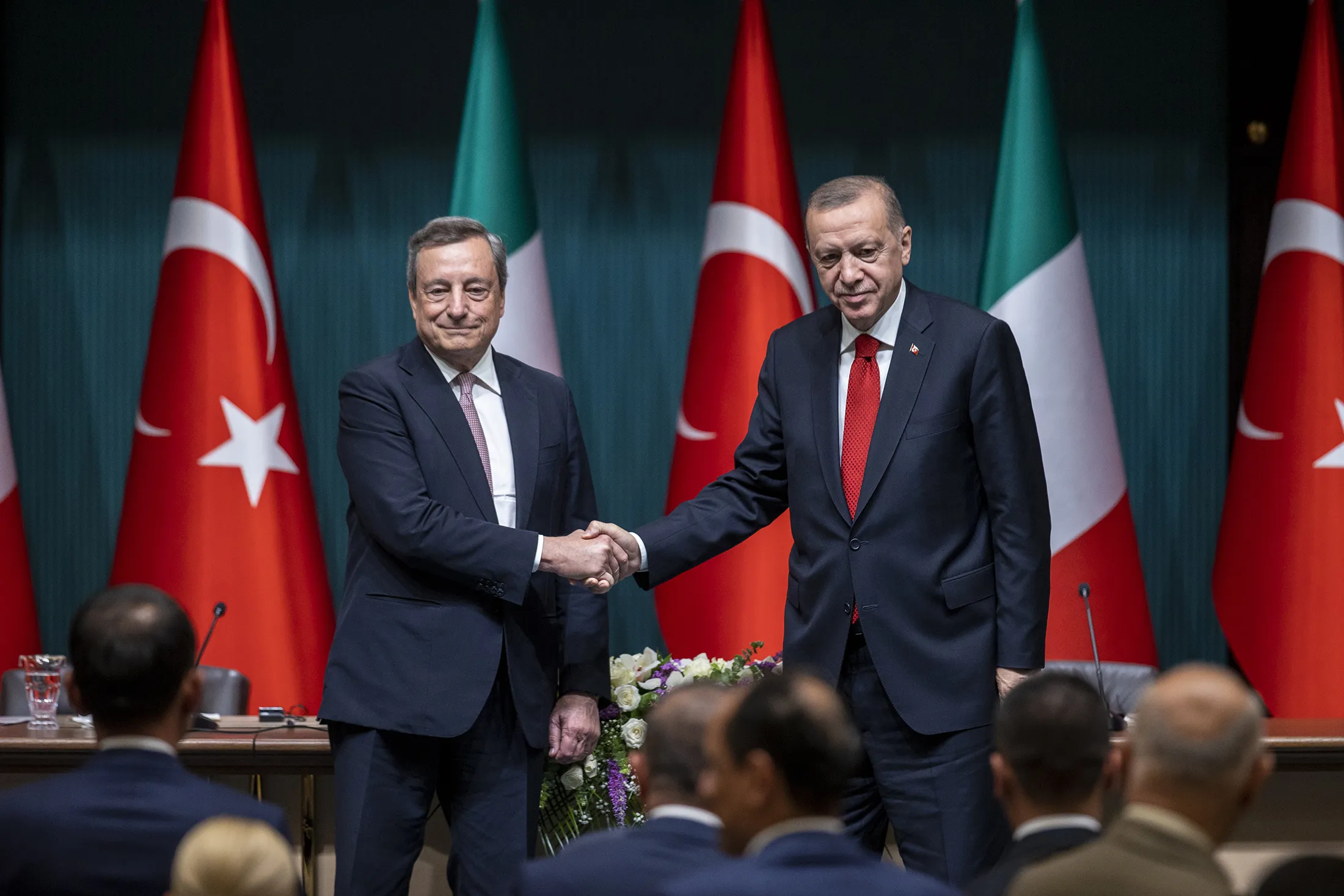 Recep Tayyip Erdogan, right, shakes hands with Mario Draghi at the Presidential Complex in Ankara on July 5.