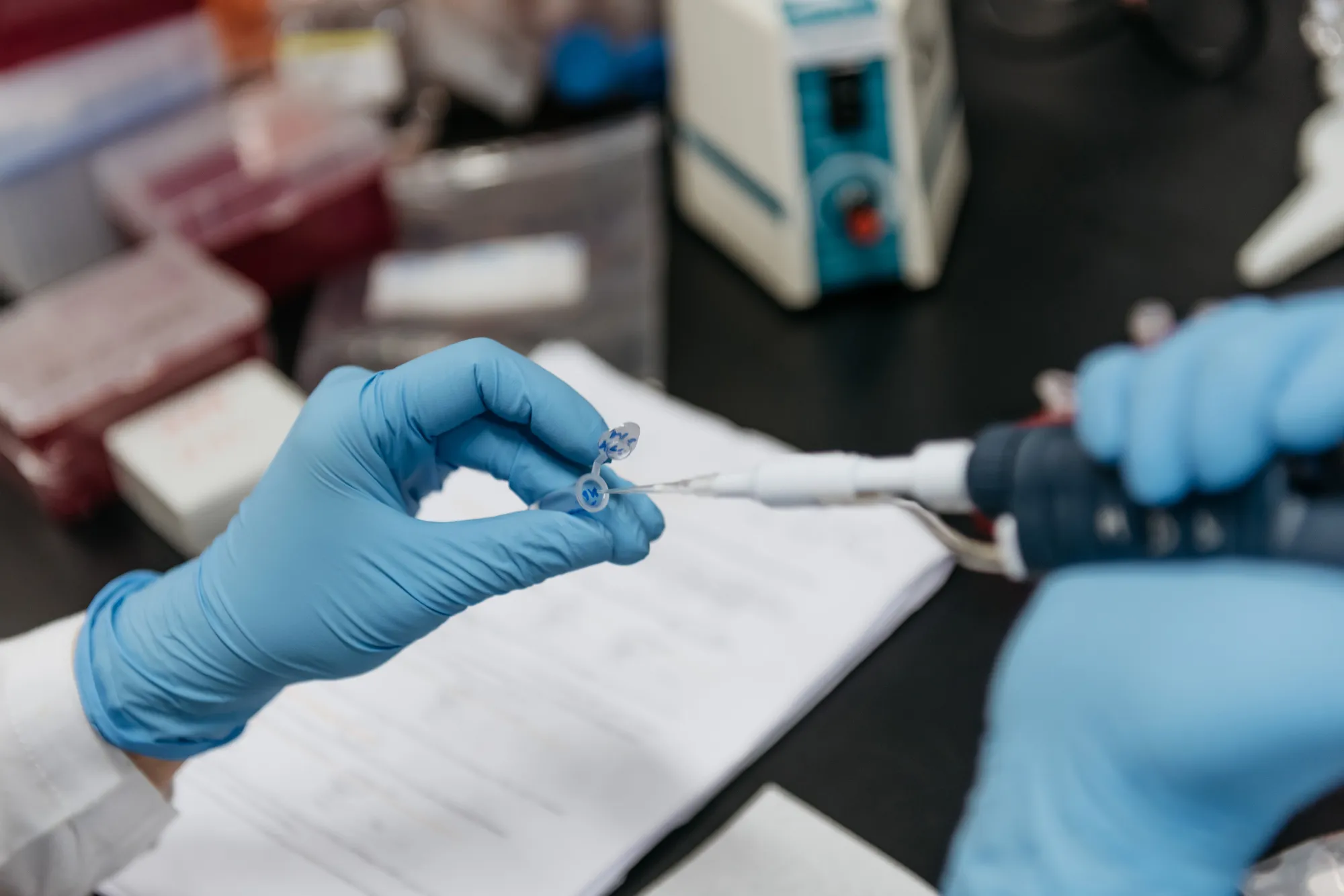 A technician prepares a sample inside a laboratory