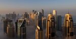 Morning fog shrouds residential and commercial skyscrapers in the marina district of Dubai.