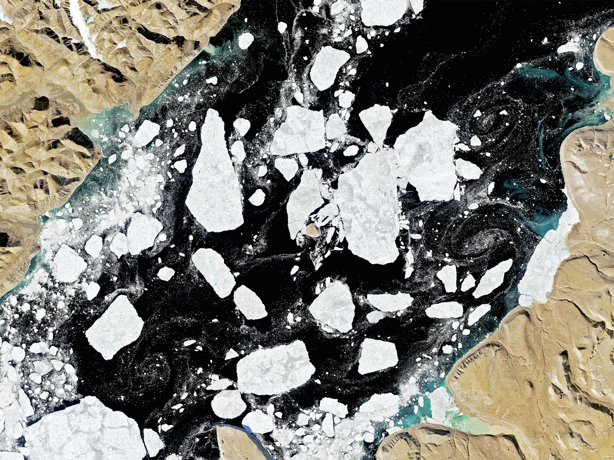 A satellite image of Hans Island between Canada, left,&nbsp;and Denmark, right, in 2016.