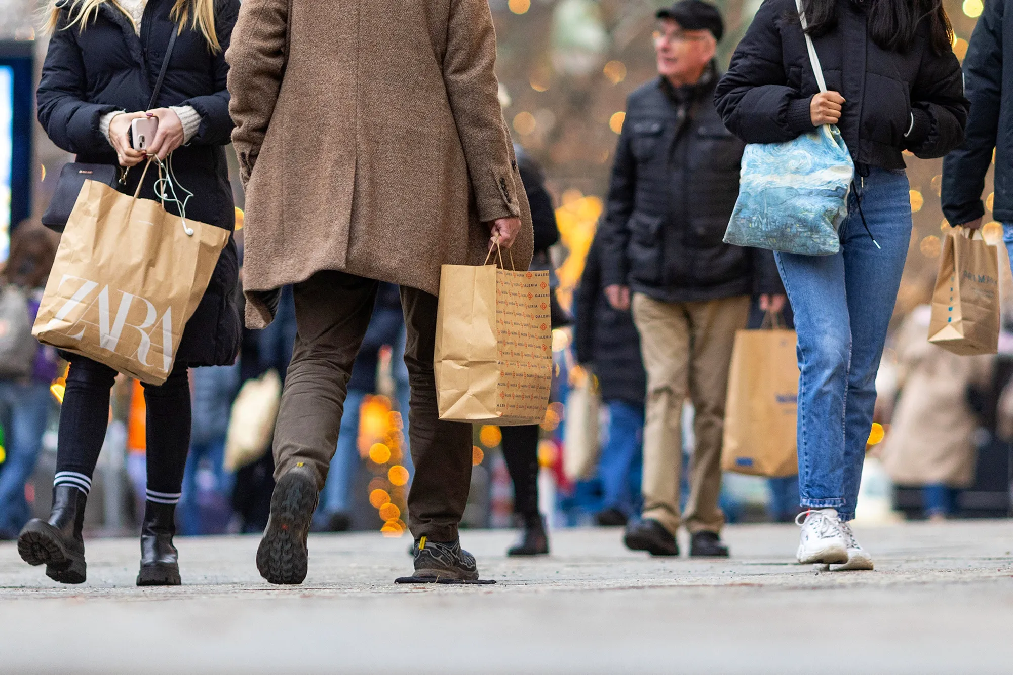 Shoppers walk along a street in Berlin.