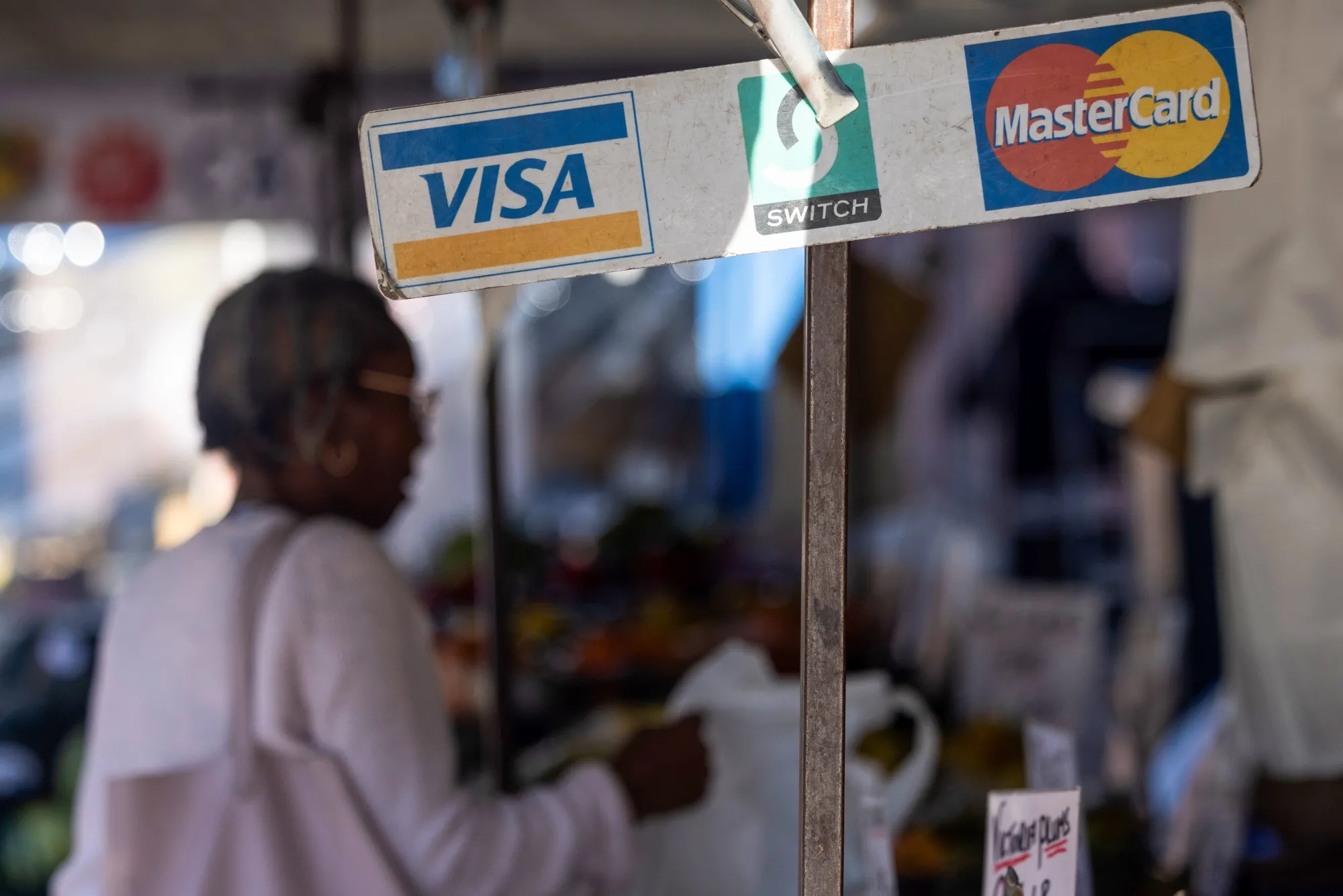 A sign for Visa Inc. and Mastercard Inc. at a market in Ipswich.