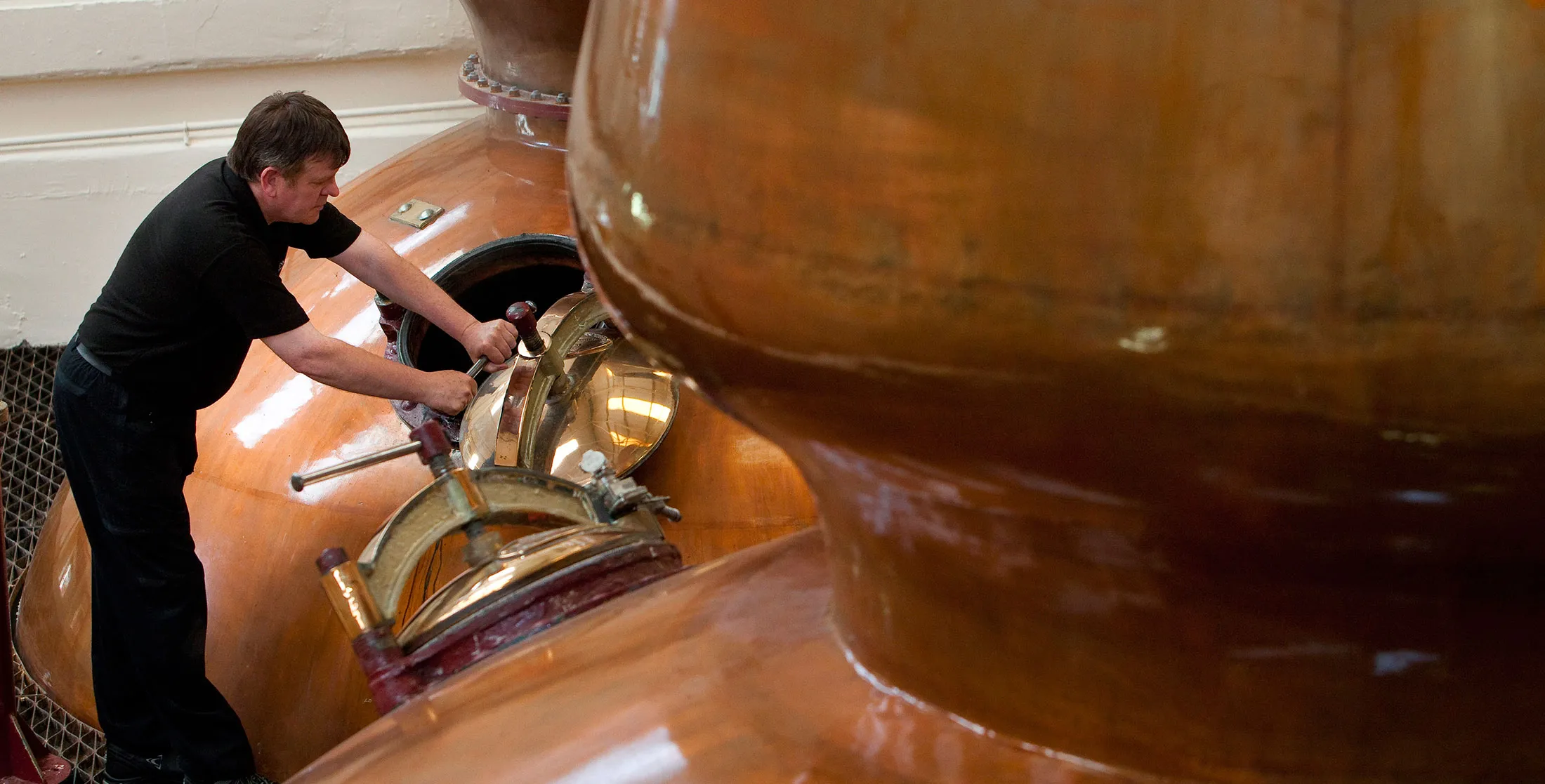 A Diageo employee is seen at work in the Stillhouse at Glenkinchie Distillery, East Lothian, Scotland.
