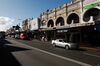 Pedestrians walk past stores during a partial lockdown imposed due to the coronavirus in the Mosman suburb of Sydney, Australia, on Tuesday, May 5, 2020. Australia’s central bank kept the interest rate and yield objective unchanged as it braces for the shock from the shuttering of large parts of the economy to stem the spread of the coronavirus.