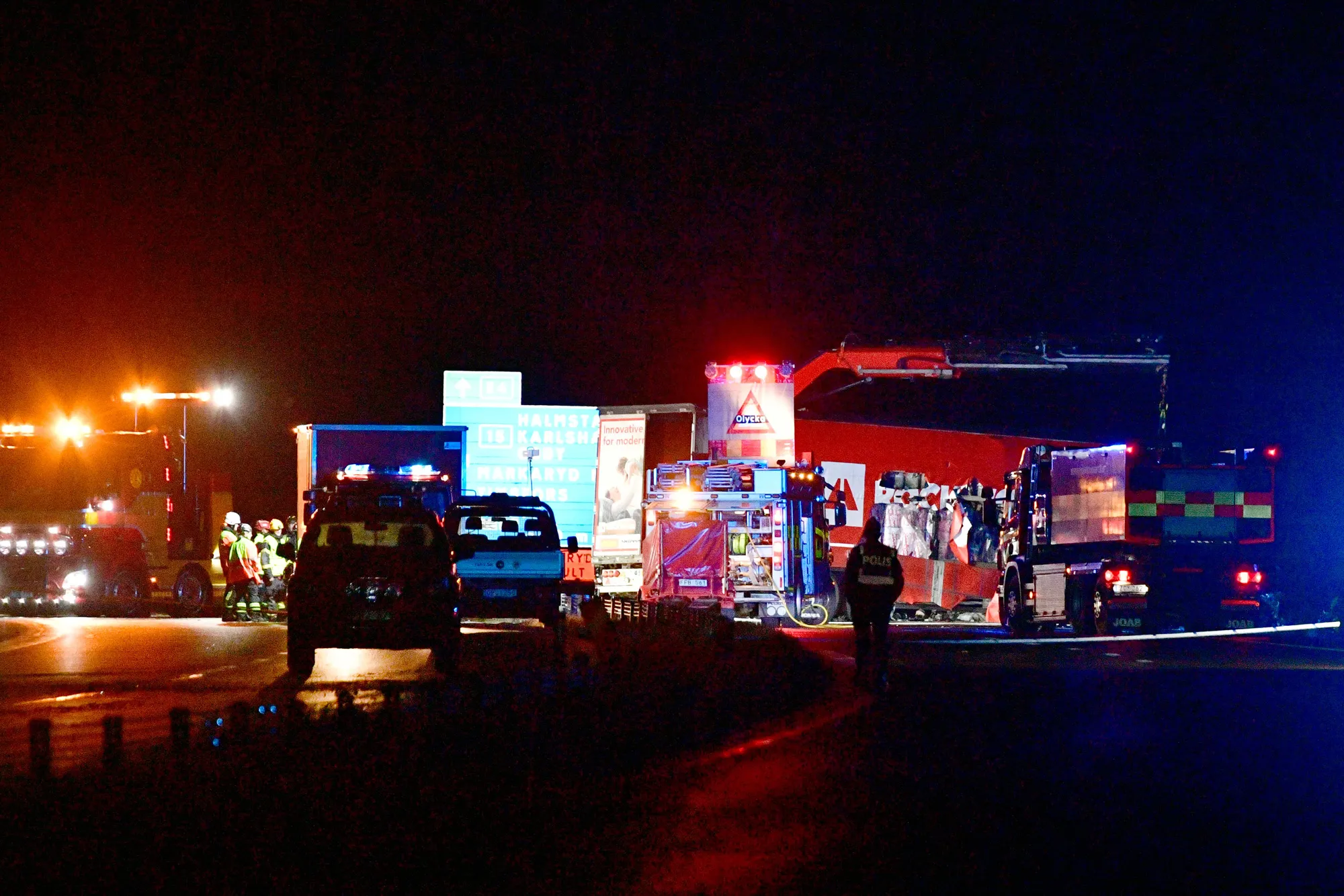 Emergency services attend the scene of the crash that killed Lars Vilks and two police officers, in&nbsp;Markaryd, Sweden, on Oct. 3.