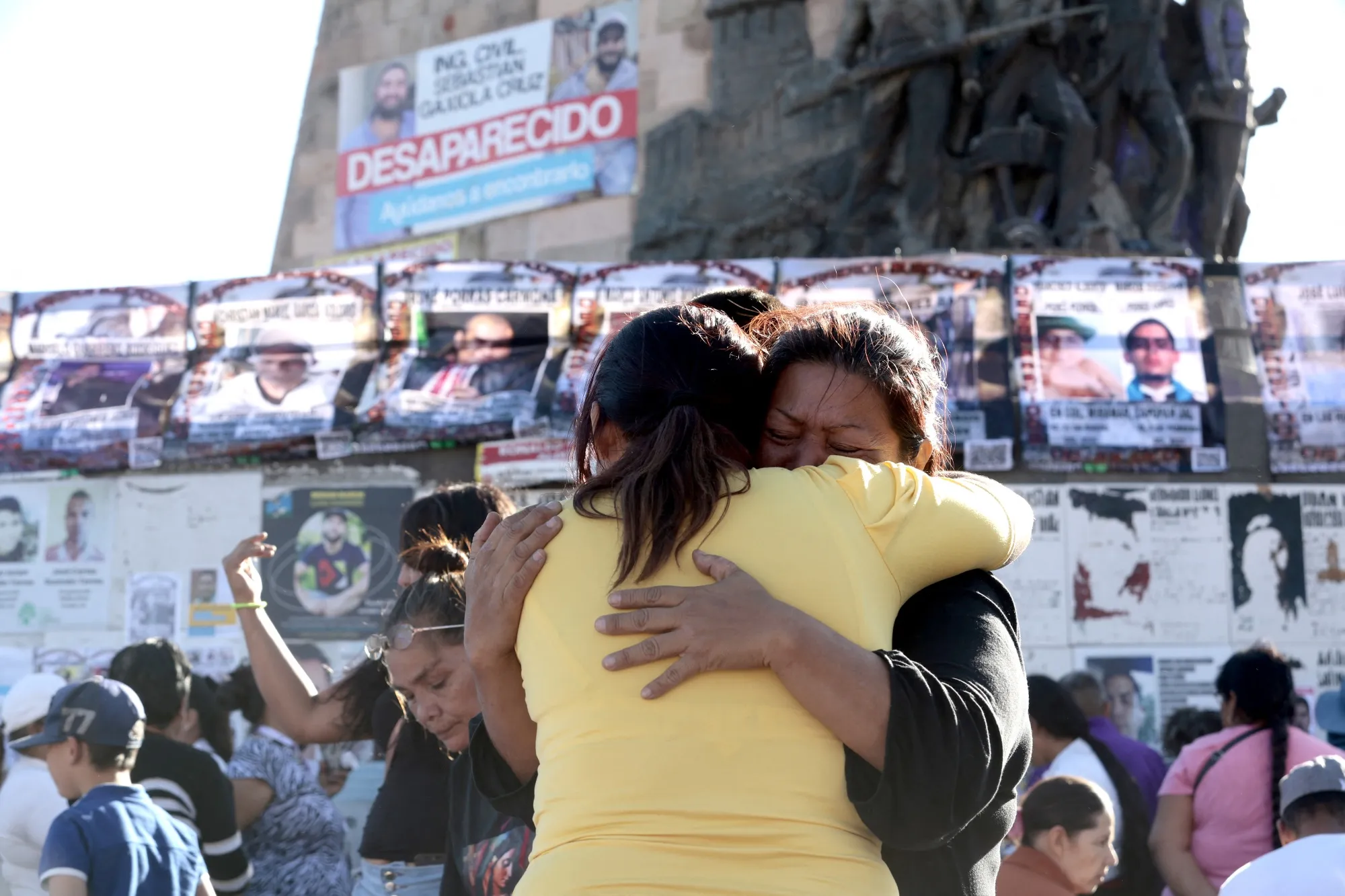 Relatives of people who allegedly lost their lives in the 'Izaguirre Ranch' embrace during a mass, in Guadalajara, Jalisco, Mexico on March 14, 2025.