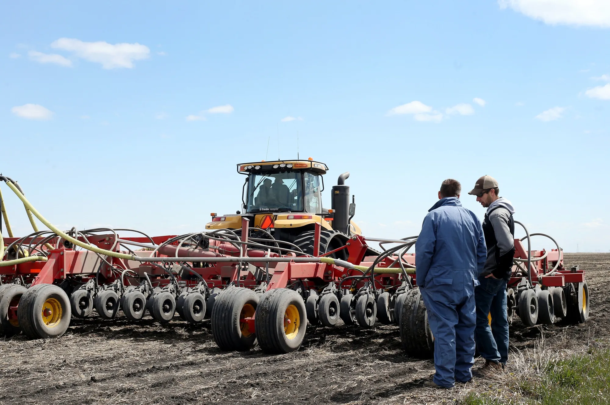 An AGCO Corp. Challenger tractor pulls an air seeder.