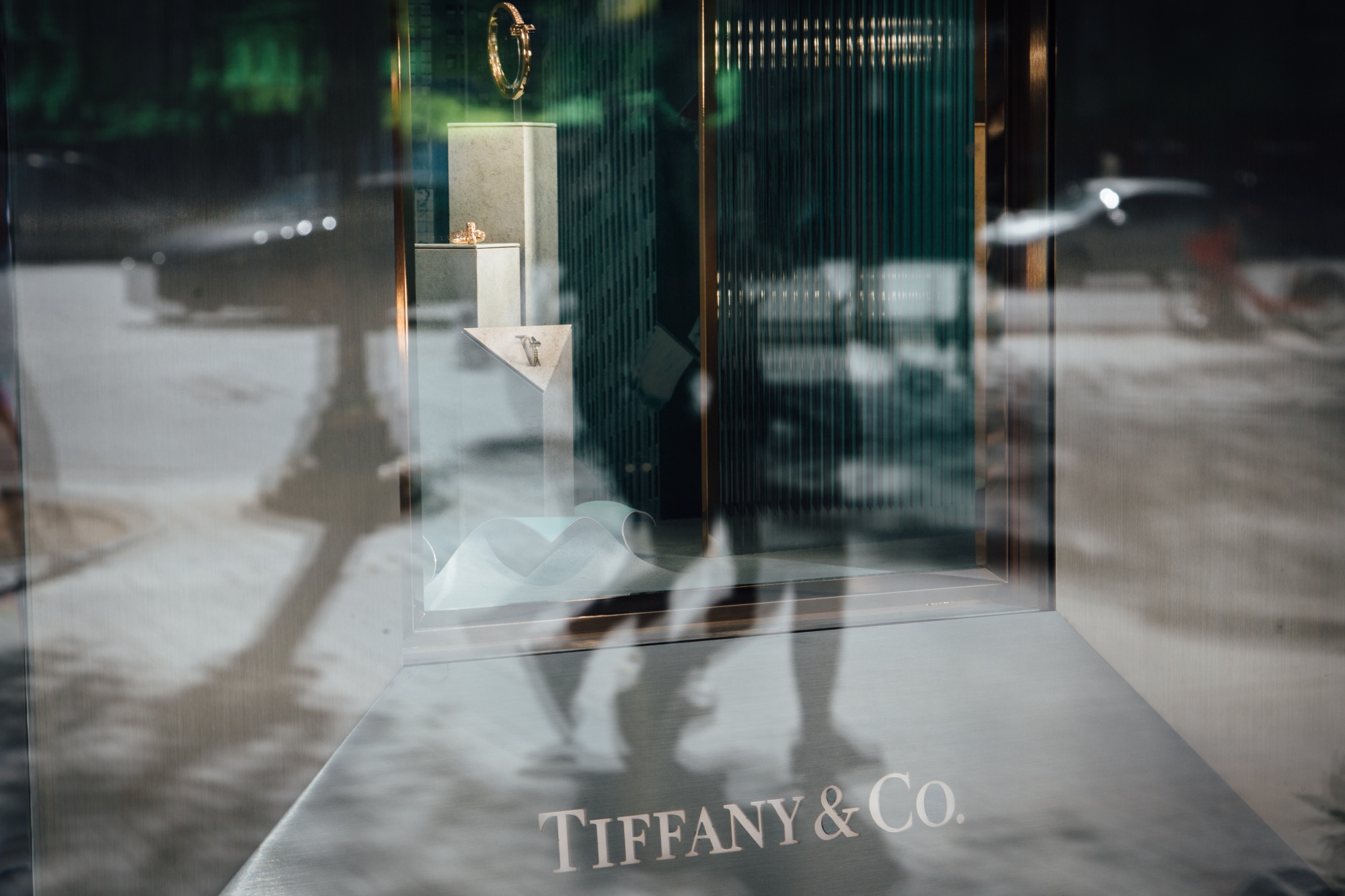 A Tiffany & Co. logo is found in a window at the company's luxury jewelry store on the Champs-Elysees in Paris, France.