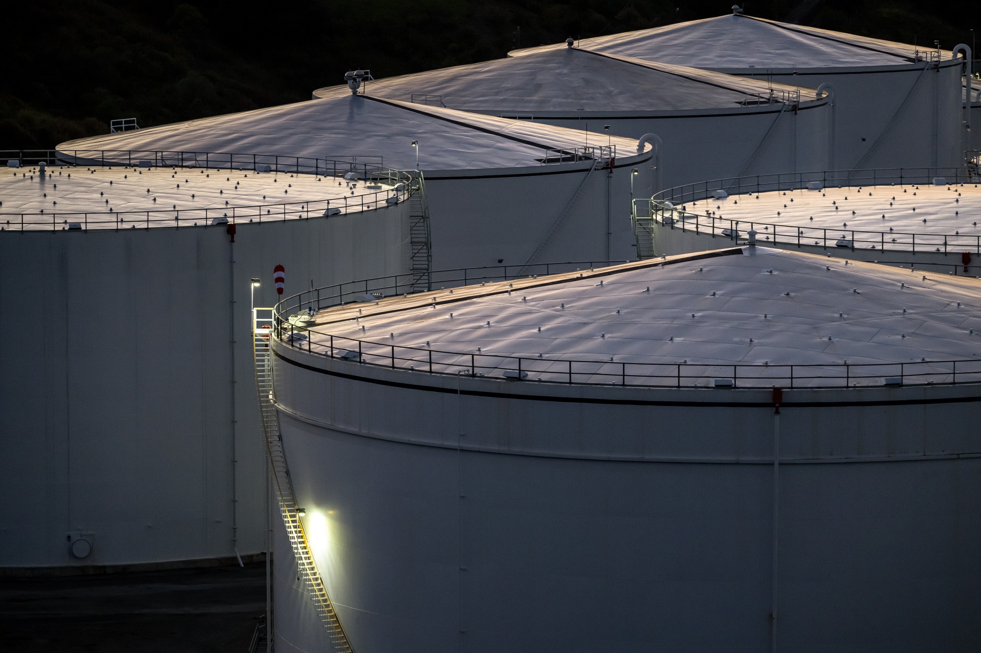 Fuel storage tanks at the Sunoco LP Terminal in Crockett, California, US, on Sunday, March 1, 2026. Oil surged by the most in four years, as the US-Israeli war against Iran plunged the global crude market into turmoil, with the effective closure of the critical Strait of Hormuz.
