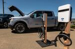 A Ford Lightning F-150 electric pickup truck next to a charging station during a media event&nbsp;in Healdsburg, California.