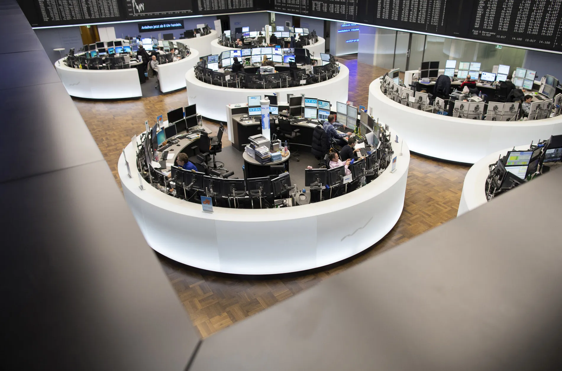 Financial traders monitor data inside Frankfurt Stock Exchange.
