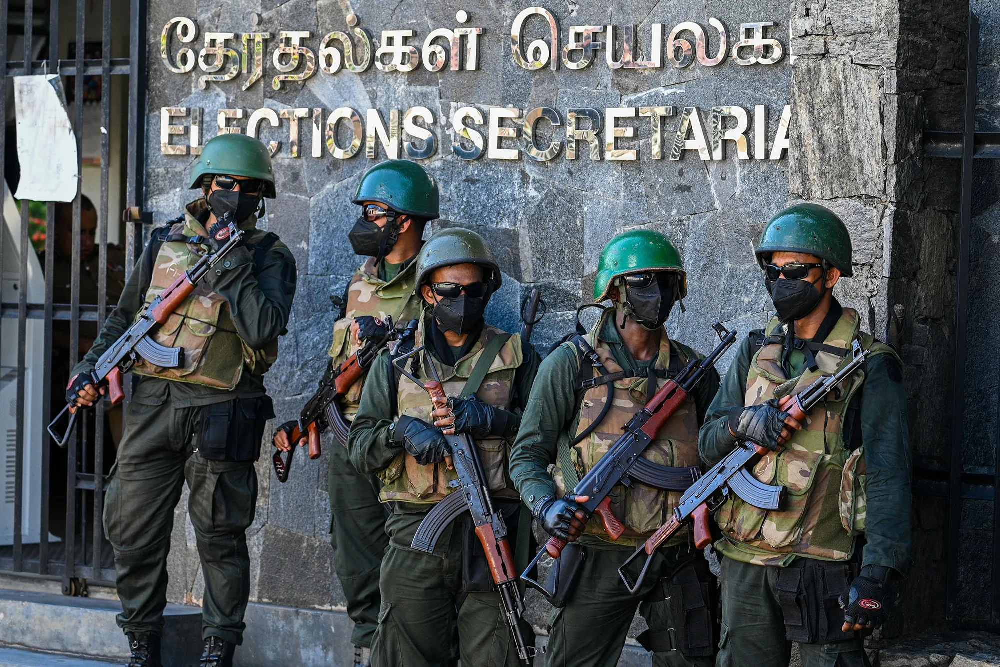 Soldiers stand guard during&nbsp;demonstration to urge the government to hold local council elections,&nbsp;in Colombo on Feb.&nbsp;22.&nbsp;
