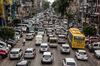 Vehicles sit in traffic along a road in Yangon, Myanmar, on Friday, Aug. 31, 2018. International criticism over Rohingya crisis has damaged Myanmar's reputation, making it harder for companies that sought opportunities in the country after the U.S. lifted broad-based sanctions following its transition to democracy.