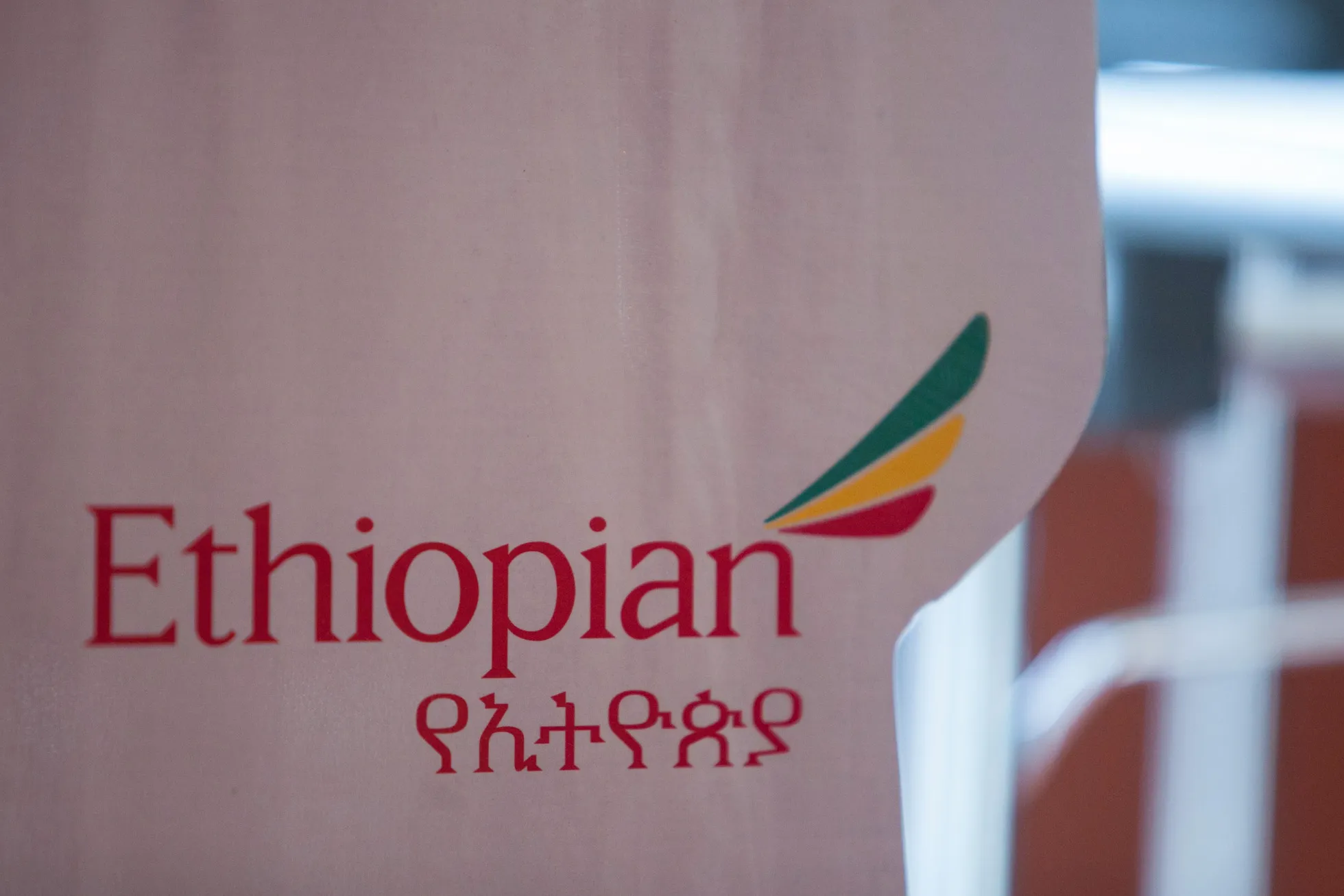 The Ethiopian Airlines Enterprise logo sits on display during a news conference at the ITB travel fair at Messe Berlin exhibition center in Berlin, Germany, on Thursday, March 6, 2014. Ethiopian Airlines said it will locate its fourth hub in the Democratic Republic of Congo as Africa's No. 2 carrier seeks to tap Chinese economic links and fill long-haul flights to destinations such as Brazil.