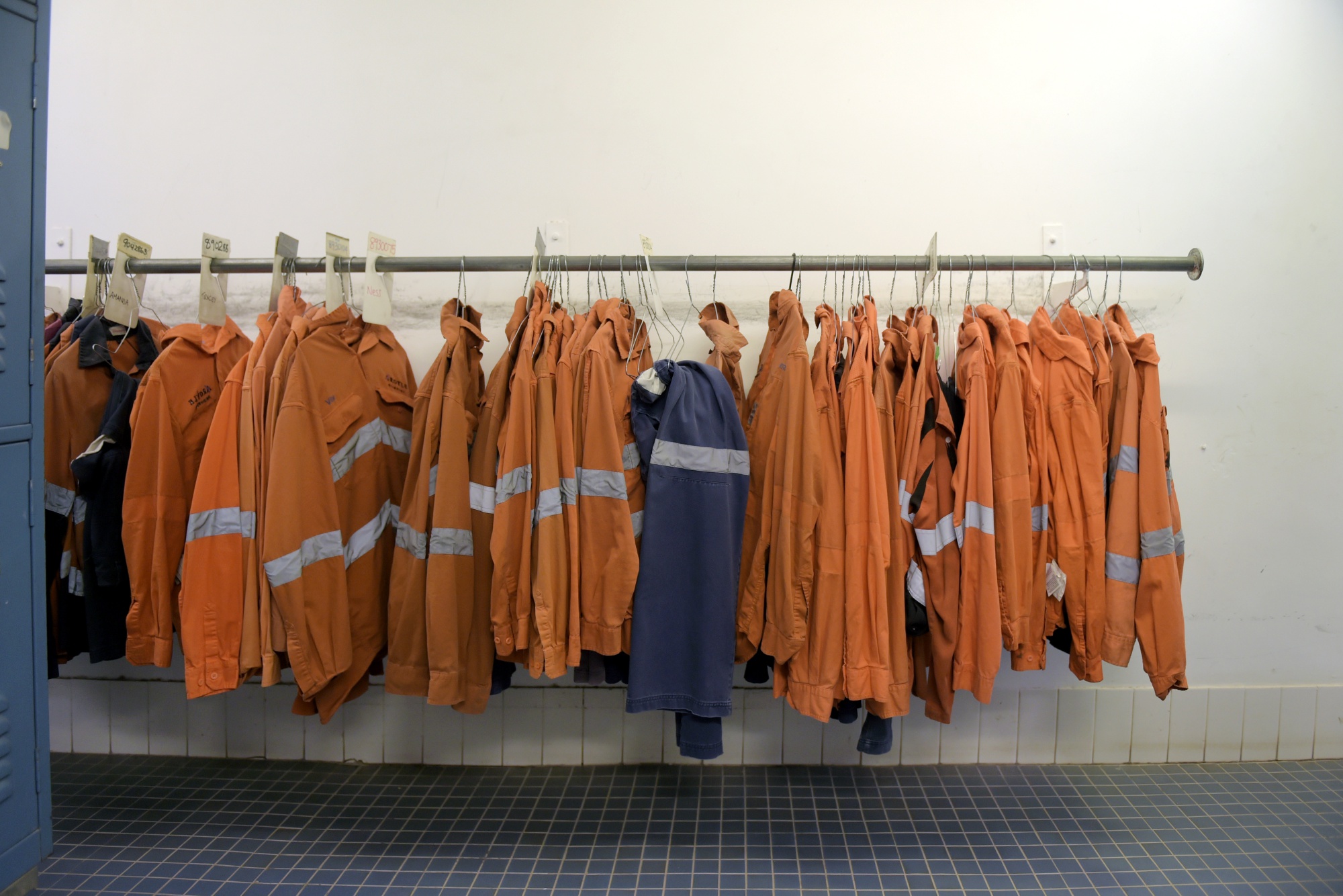 Working clothes hang in a changing room at the Argyle diamond mine operated by the Rio Tinto Group in Western Australia.