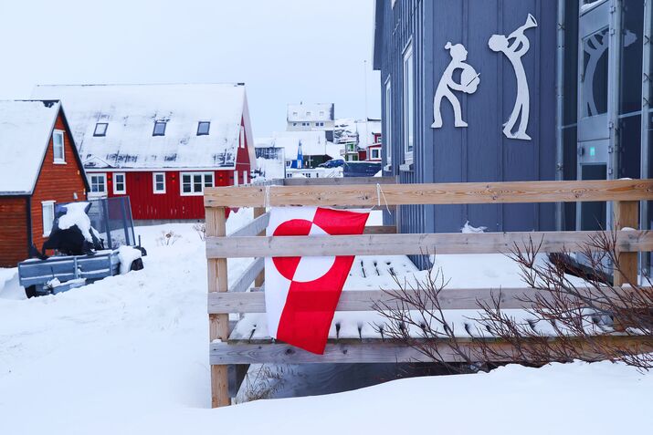 A Greenlandic flag hangs from a home in Nuuk.