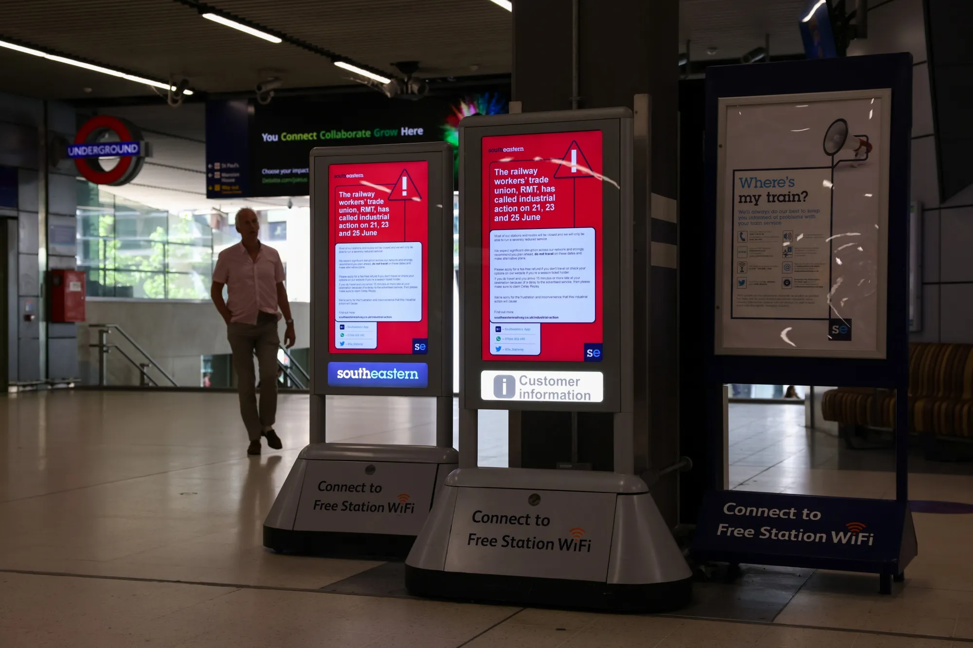 Signs warning commuters of upcoming industrial action at London Cannon Street railway station in London.