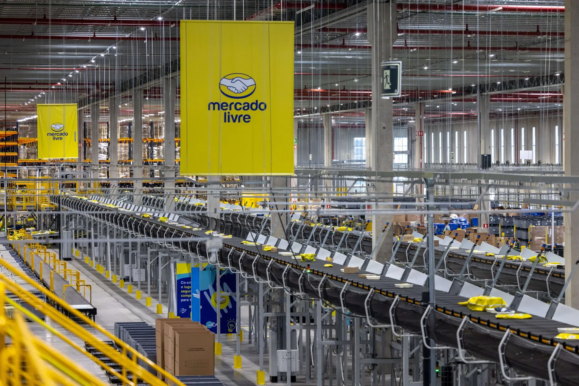Packaged products move on conveyor belts at the MercadoLibre fulfillment center in Sao Paulo, Brazil, on Friday, Nov. 24, 2023.