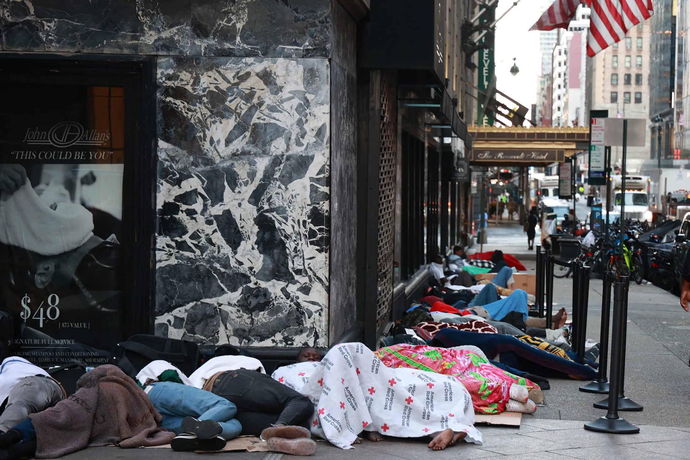 Migrants outside the Roosevelt Hotel in Midtown Manhattan on July 31, 2023.&nbsp;