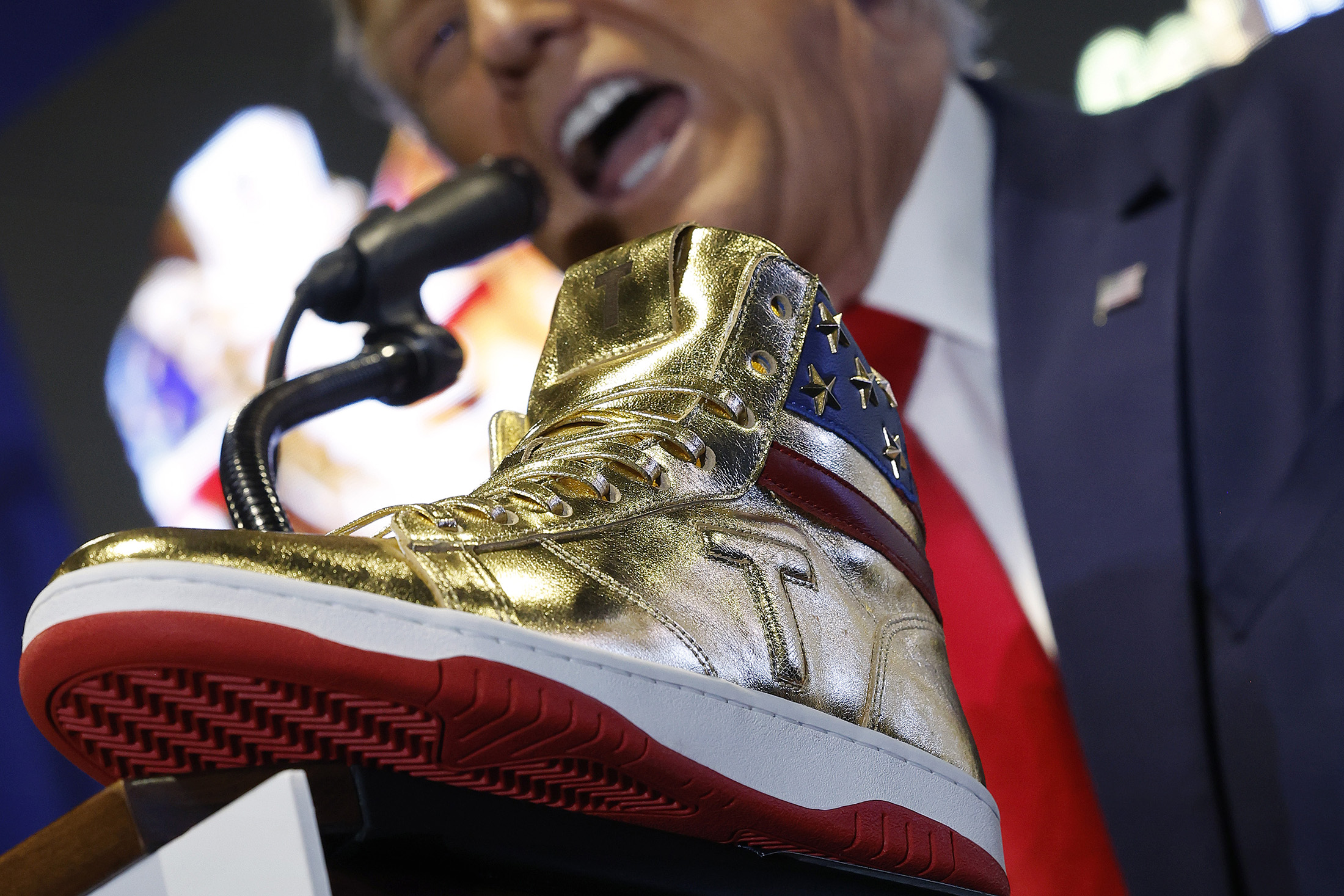 Trump Hawks Gold, SelfBranded 399 Sneaker as Legal Fees Mount Bloomberg