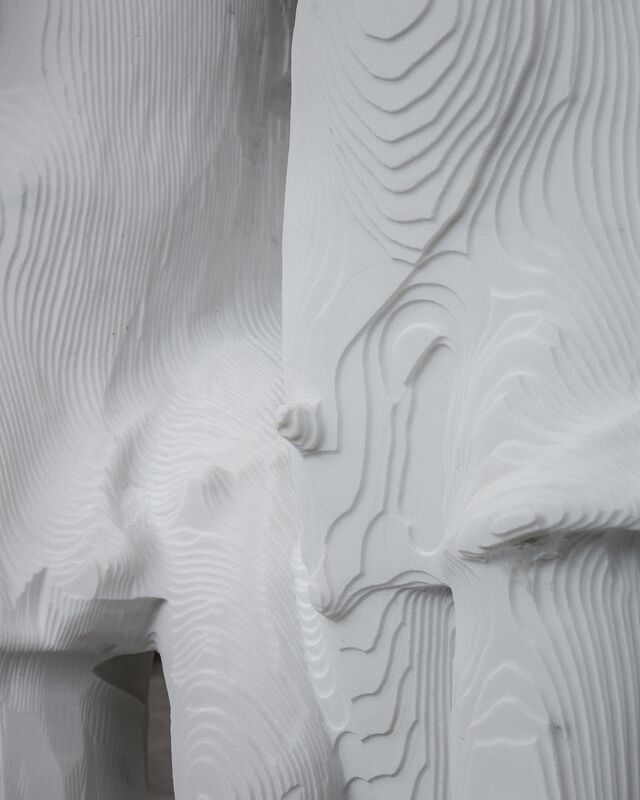 A robot-carved statue awaits hand-finishing.