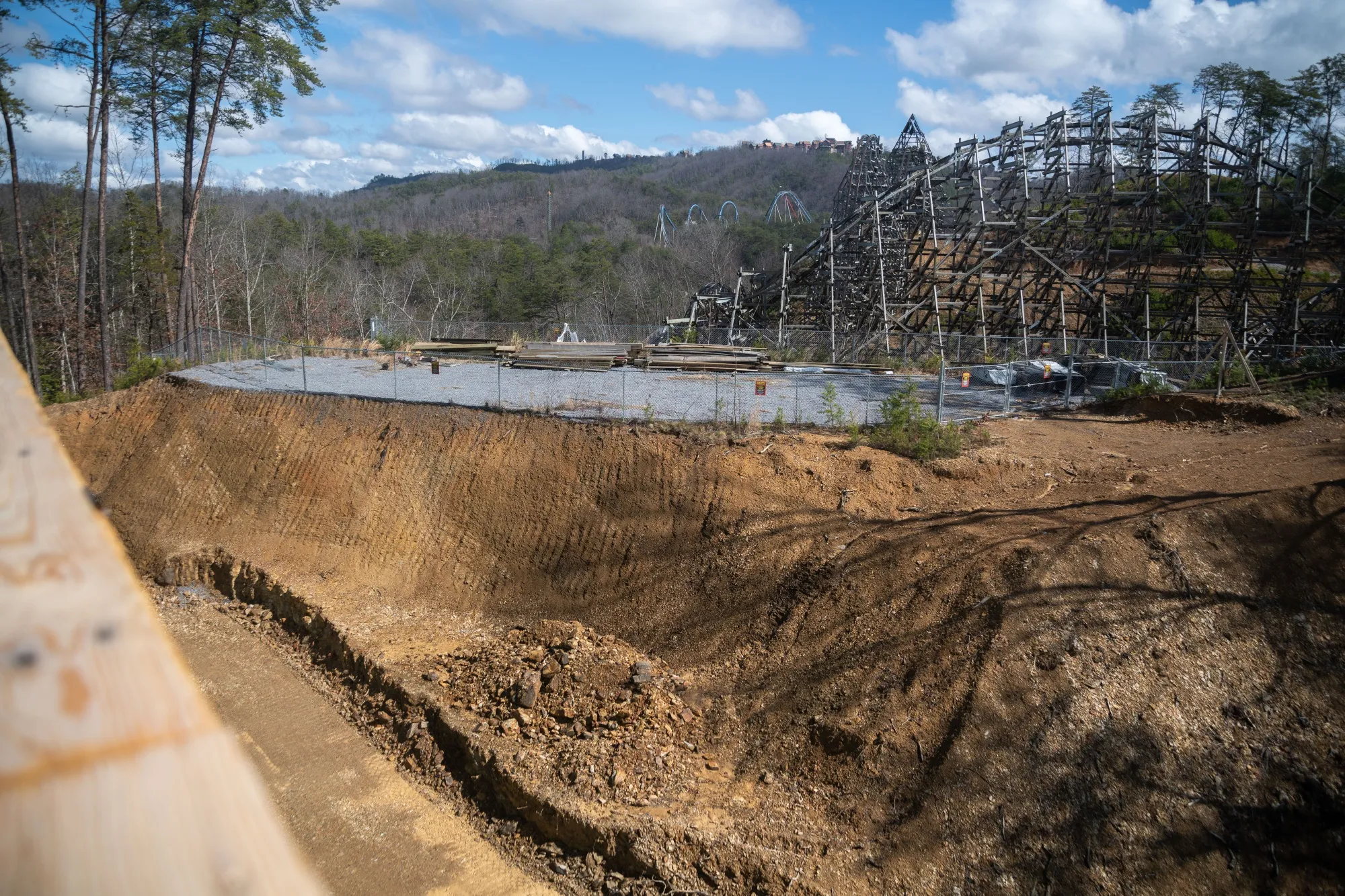 A Dollywood roller coaster is the backdrop for an employee residence hall under construction in Pigeon Forge, Tennessee.