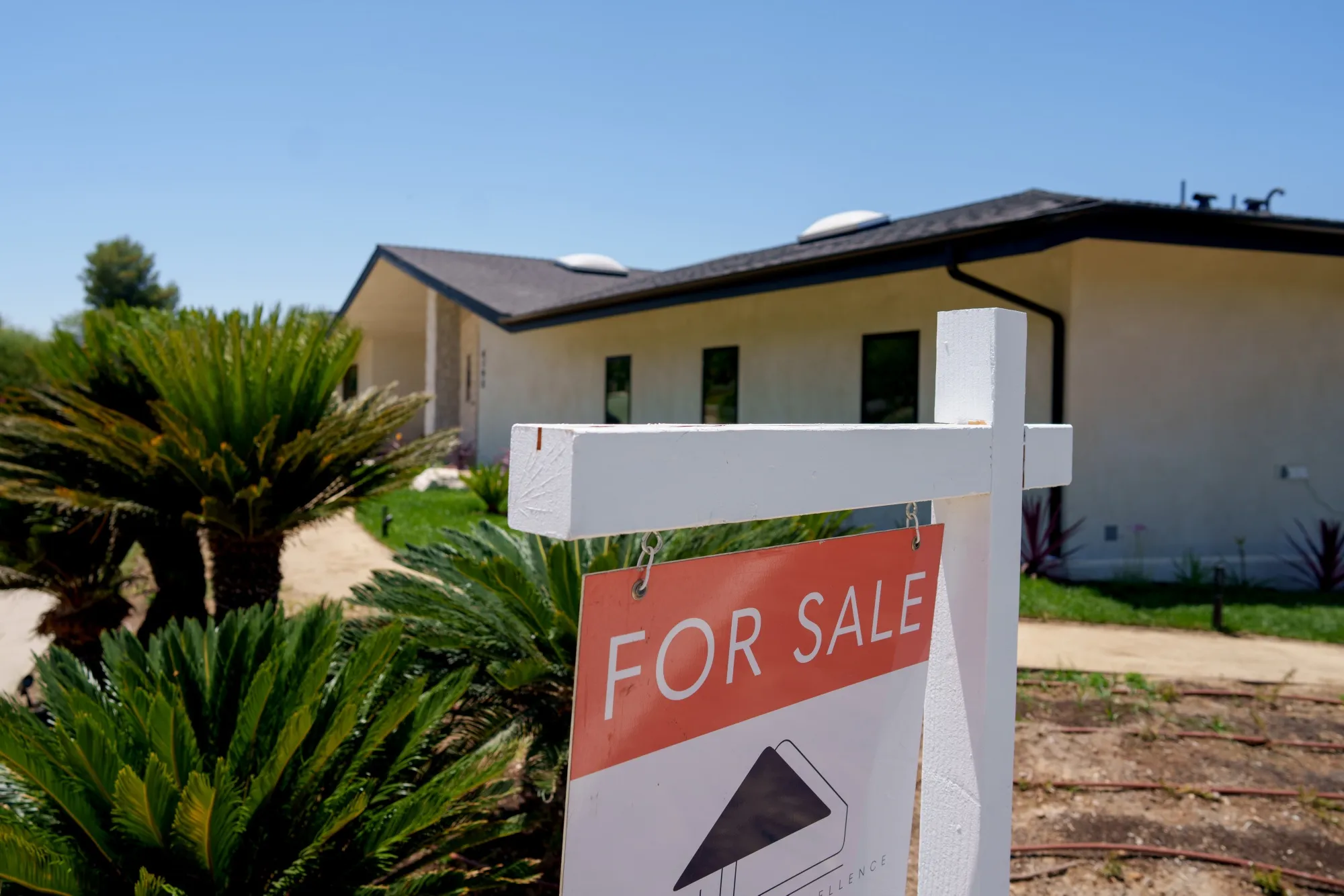 A "For Sale" sign in front of a home in Los Angeles.