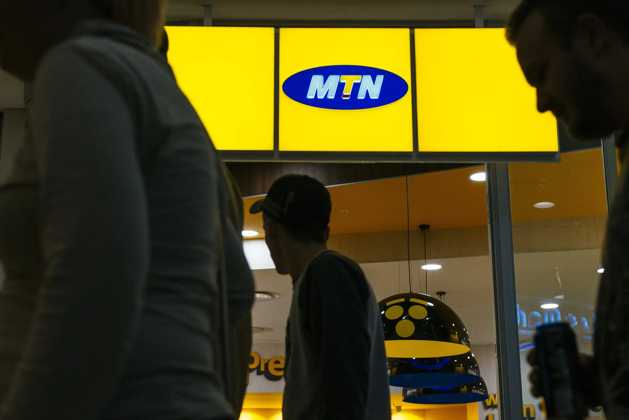 Shoppers pass an MTN Group Ltd. store&nbsp;in Johannesburg, South Africa.&nbsp;