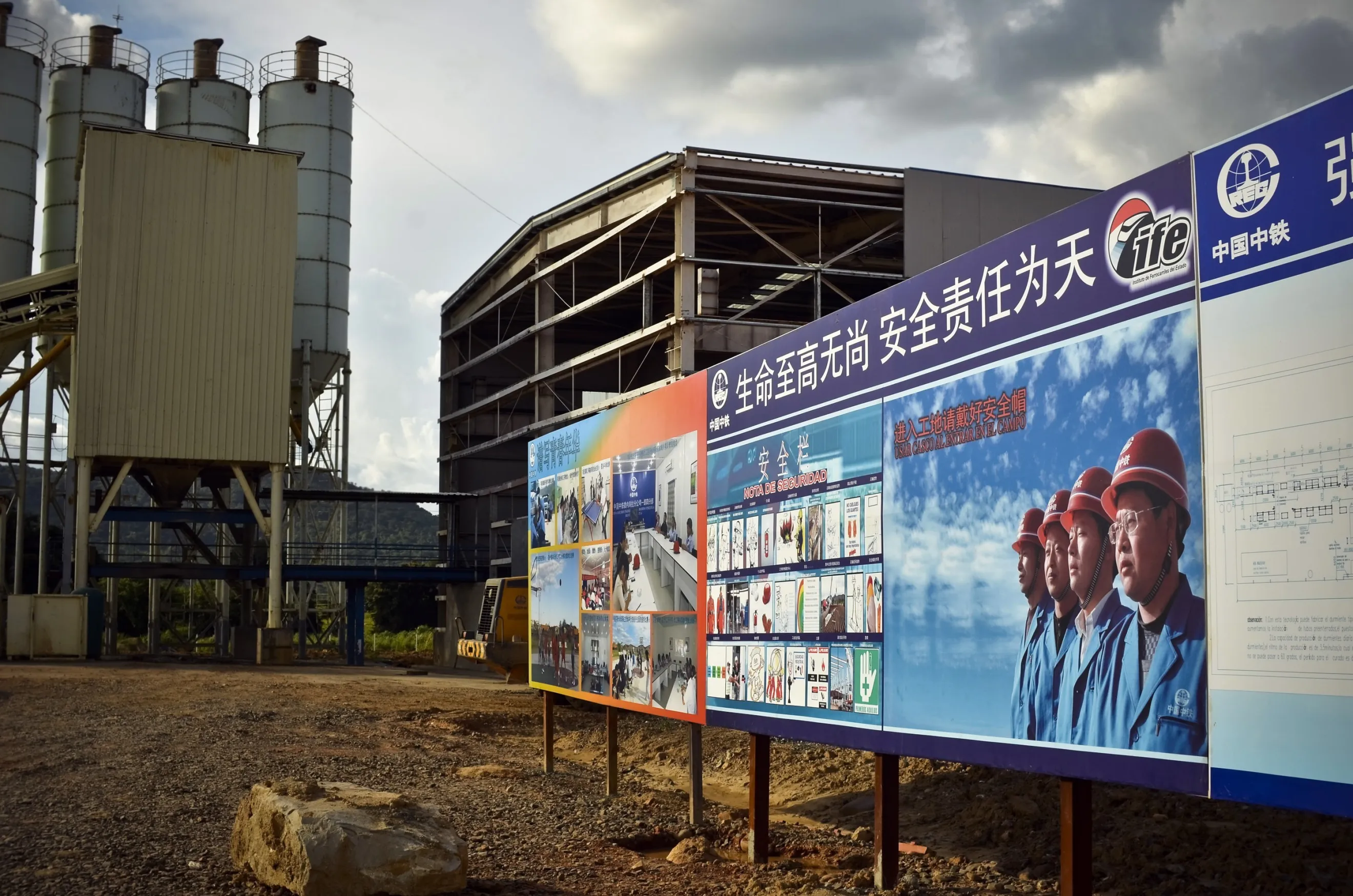 Signs depicting Chinese workers mark the entrance to a rail factory at China Railway Engineering Corporation's (CREC) Tinaco-Anaco railway project in Los Dos Caminos, Venezuela&nbsp;in 2012.