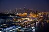 Buildings stand illuminated at the harbor front area with the central business district in the background, at night in Sentosa Island in Singapore, on Saturday, June 9, 2018. U.S. President Donald Trump and North Korean leader Kim Jong Un will hold their historic Singapore summit at the Capella Hotel on the city-states Sentosa Island on June 12.