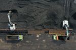 Coal is loaded onto a barge in Jakarta.