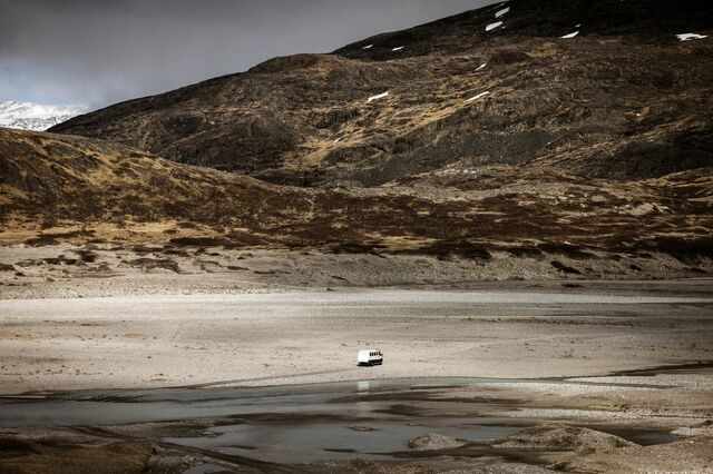 A vehicle crosses a dried up inlet located just a few kilometers southwest of the Kiagtût Sermiat glacier, near Narsarsuaq. Much of the southern Greenland region near the Tanbreez mine is covered by rocky mountains that make travel difficult.