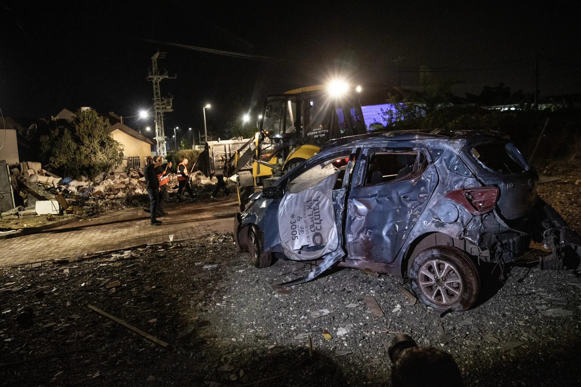 A destroyed car after the Palestinian factions fired barrages of rockets into Israel on May 10.