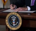 President Joe Biden signs executive&nbsp;orders related to his racial equity agenda in the State Dining Room of the White House on Jan.&nbsp;26.&nbsp;